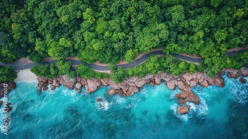 Aerial View of Road Along Rocky Seashore with Lush Greenery and Blue Ocean Waves on Praslin Island – Top-Down Perspective Captured by DJI Mavic Pro Drone

 photo