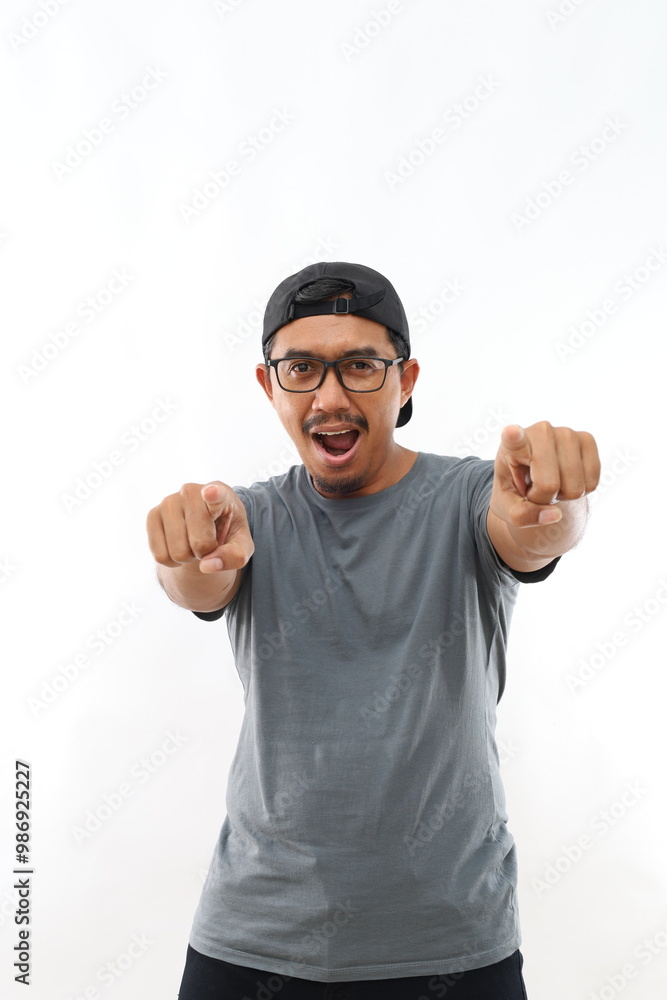 Young handsome asian man with beard wearing casual shirt and glasses over white background pointing to you and the camera with fingers, smiling positive and cheerful Young handsome asian man with beard wearing casual shirt and glasses over white background pointing to you and the camera with fingers, smiling positive and cheerful