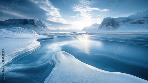 Wallpaper Mural An awe-inspiring image of a remote, pristine glacier with dramatic ice formations and a serene, snow-covered landscape. The cool blue tones of the ice contrast with the rugged, untouched mountains in Torontodigital.ca