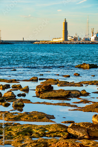 Fanale dei Pisani Lighthouse and Rocky Coastline photo