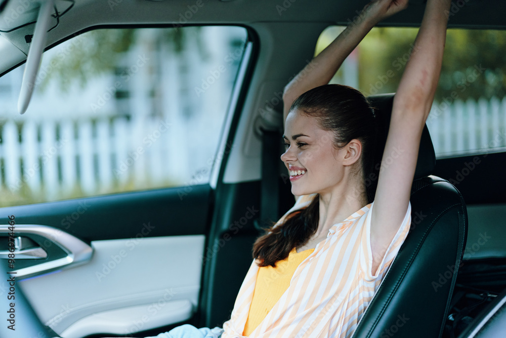 young woman relaxing inside car, stretching arms, smiling, summer day, outdoor background, bright atmosphere, feeling free, happiness, carefree moments captured young woman relaxing inside car, stretching arms, smiling, summer day, outdoor background, bright atmosphere, feeling free, happiness, carefree moments captured