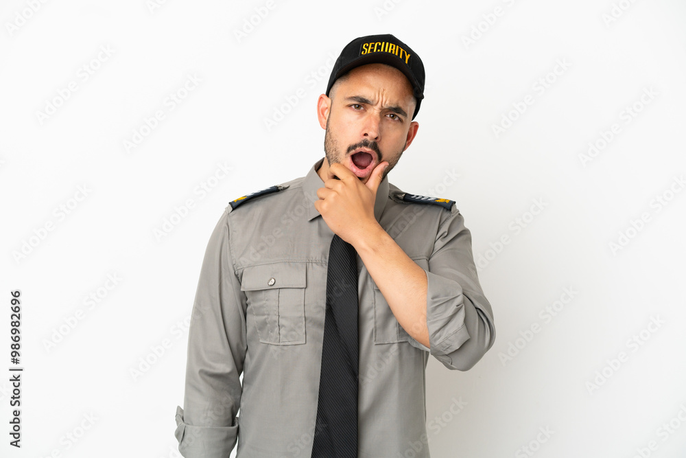 Young security caucasian man isolated on white background surprised and shocked while looking right Young security caucasian man isolated on white background surprised and shocked while looking right