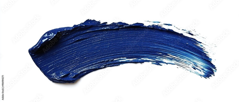A single stroke of blue paint on a white background. A single stroke of blue paint on a white background.