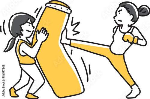 サンドバッグにキックを入れる女性