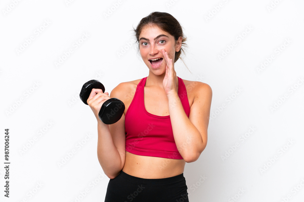 Young sport caucasian woman making weightlifting isolated on white background shouting with mouth wide open Young sport caucasian woman making weightlifting isolated on white background shouting with mouth wide open