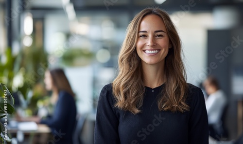 Confident businesswoman smiling in modern office setting