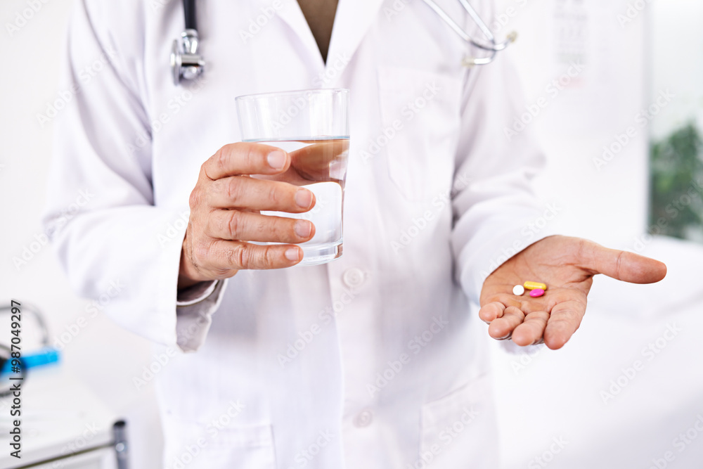 Pills, water and doctor with hand of person in hospital for offer, medical advice and diagnosis. Medicine, insurance and consulting with expert and supplements for healthcare, cure and pharmacist Pills, water and doctor with hand of person in hospital for offer, medical advice and diagnosis. Medicine, insurance and consulting with expert and supplements for healthcare, cure and pharmacist