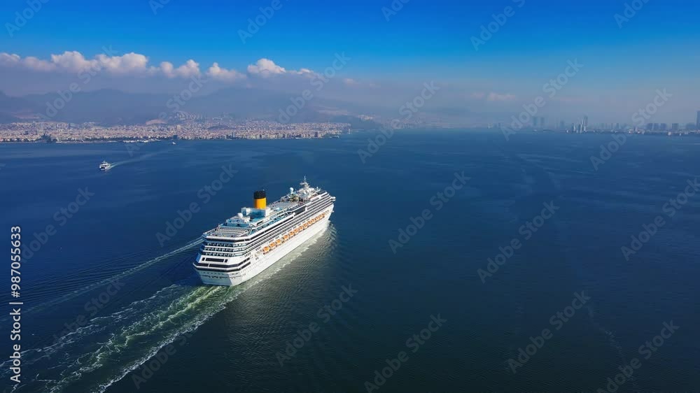 Cruise ship sailing across sea, Aerial, white cruise liner in a sunny day. Luxury cruise in the ocean sea concept tourism travel Cruise ship sailing across sea, Aerial, white cruise liner in a sunny day. Luxury cruise in the ocean sea concept tourism travel