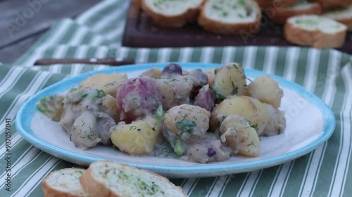 boiled multi-colored potatoes on a plate on the table close-up