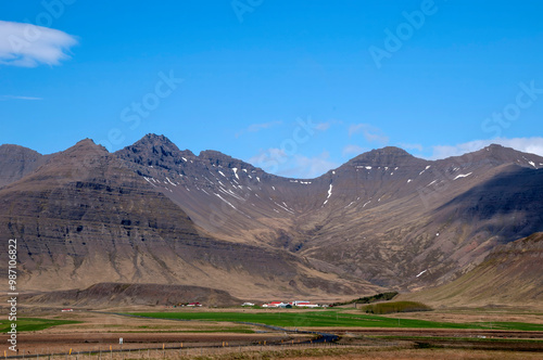 Snaefellsnes peninsula Iceland, landscape with farm buildings at bottom of mountain range photo