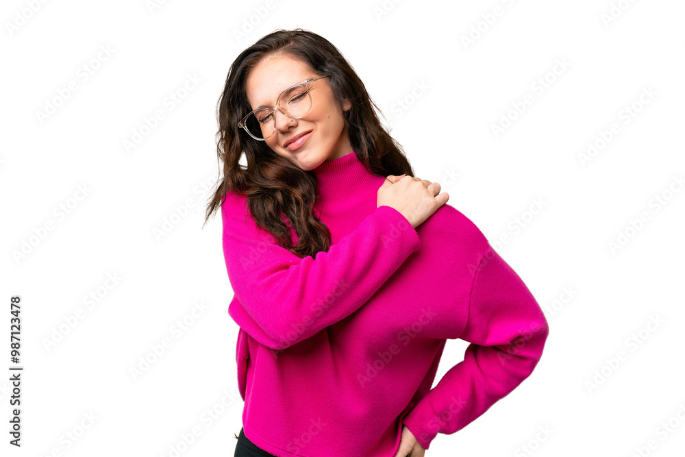 Young caucasian woman isolated over isolated background suffering from pain in shoulder for having made an effort Young caucasian woman isolated over isolated background suffering from pain in shoulder for having made an effort