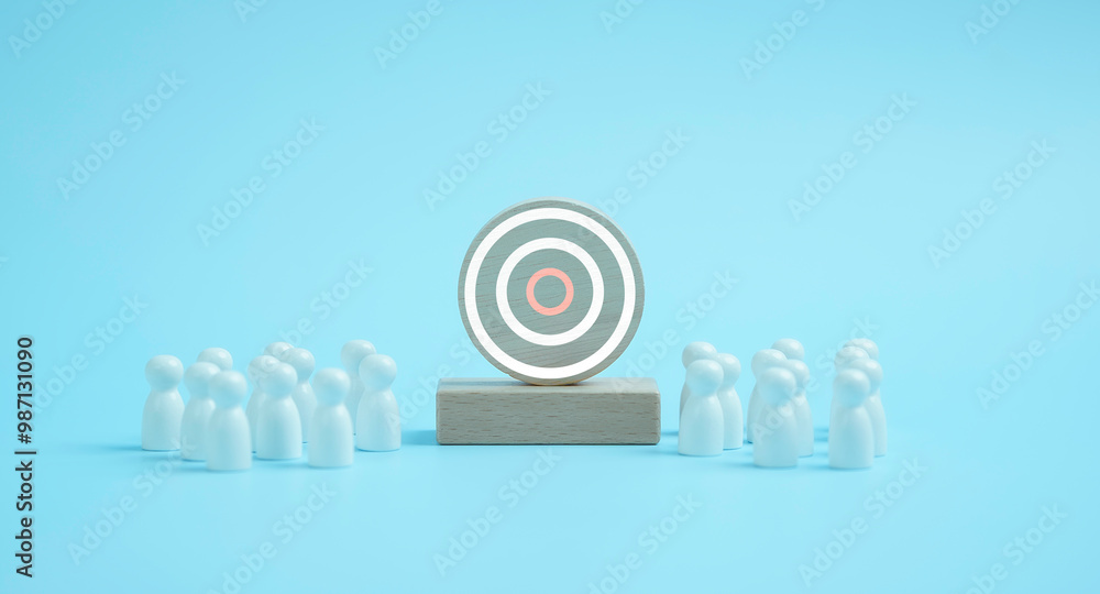 Target concept of business and personnel . white wooden dolls standing around Dart board and arrows for creating and targeting business objectives. Marketing solutions, targets for business