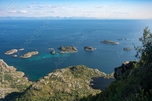 Ocean view with rocky islands and mountain slopes near Henningsvaer city, Lofoten Norway photo