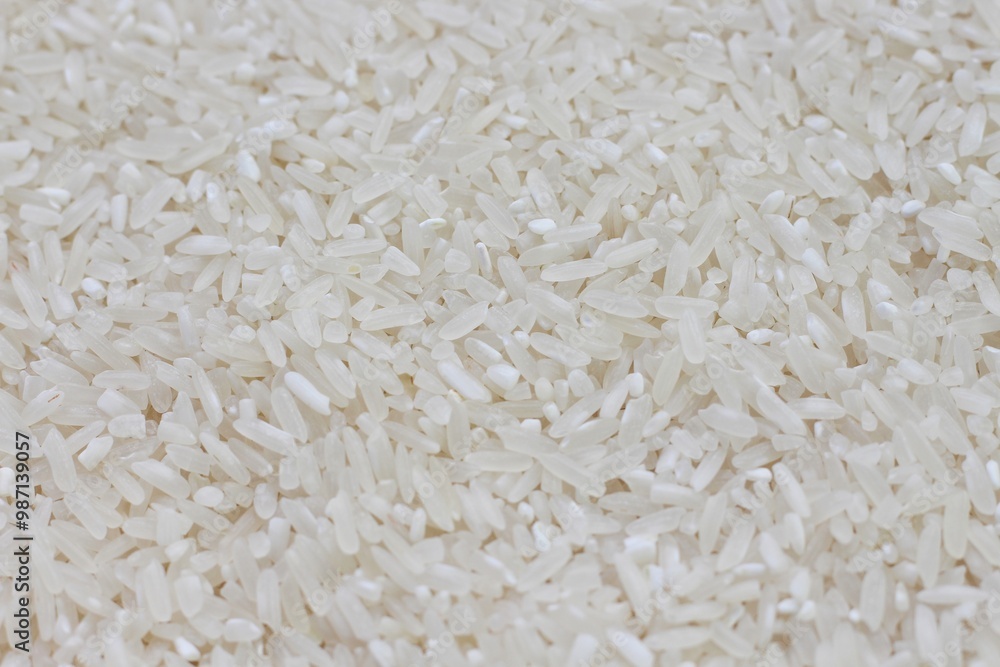 Dry Uncooked White Rice Background - Top View, Flat Lay. Scattered Raw Long Grain Rice. Asian Cuisine and Culture. Healthy Eating Ingredients. Diet Food Dry Uncooked White Rice Background - Top View, Flat Lay. Scattered Raw Long Grain Rice. Asian Cuisine and Culture. Healthy Eating Ingredients. Diet Food