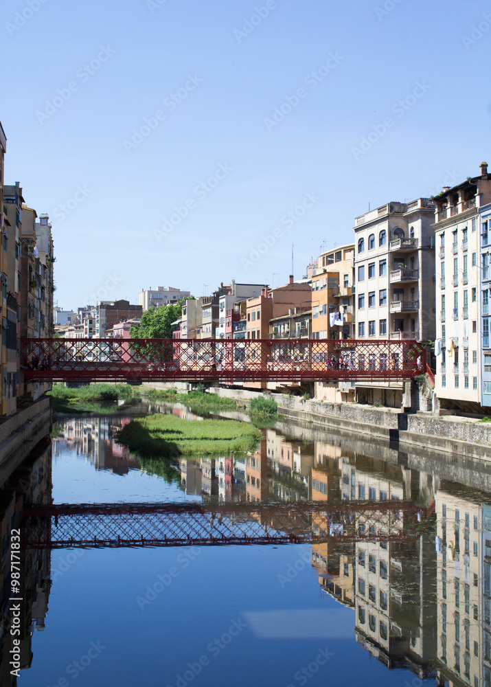 View of the old town and eiffel bridge on a summer day. Gerona. Spain. View of the old town and eiffel bridge on a summer day. Gerona. Spain.