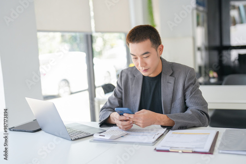 Asian Business man working with laptop. Young business man thinking Concentrated at work.