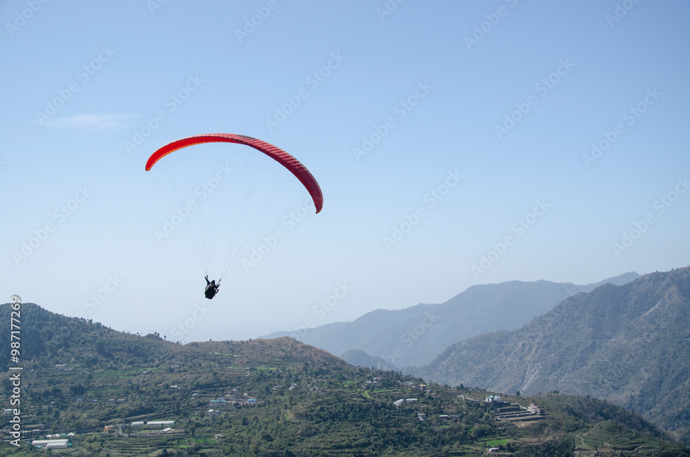 Paragliding in the sky. Flying over mountains, Extreme sport in mountain with nature, High-Flying Adventure, Uttarakhand, India. Paragliding in the sky. Flying over mountains, Extreme sport in mountain with nature, High-Flying Adventure, Uttarakhand, India.