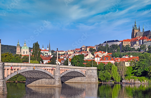 View from the bank of the Vltava river to Manes bridge and the Prague castle, Czech republic