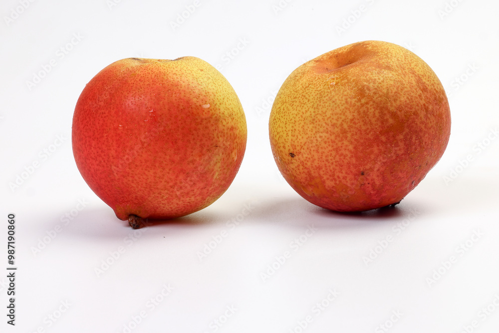 Green yellow red ripe mini pear sweet juicy on white background basket fork Green yellow red ripe mini pear sweet juicy on white background basket fork
