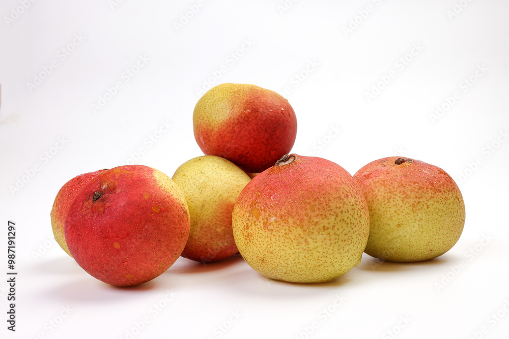Green yellow red ripe mini pear sweet juicy on white background basket fork Green yellow red ripe mini pear sweet juicy on white background basket fork
