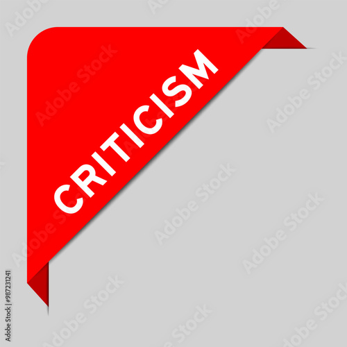 Red color of corner label banner with word criticism on gray background
