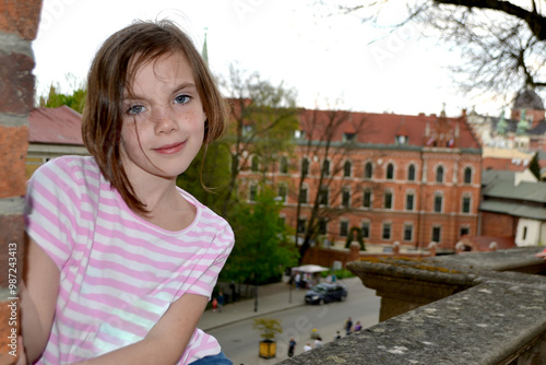 Cute kid girl 10 year old posing on nature background. Looking at camera. Childhood.Blonde girl emotions. High quality photo photo