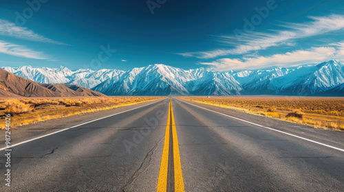 Asphalt Road Through Snowy Mountains