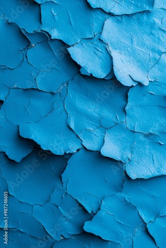  A detailed view of a blue wall with peeling paint on its edges