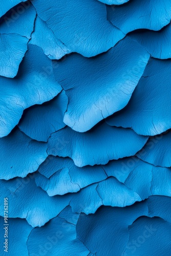 Wallpaper Mural  A close-up of a blue surface adorned with waves of curved, wavy leaves Torontodigital.ca