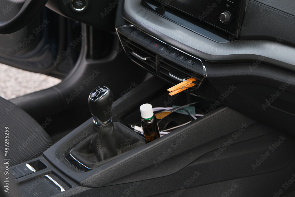 Installation of a clothespin on a car interior vent, impregnated with essential oil. To detoxify and remove unpleasant odours. Installation of a clothespin on a car interior vent, impregnated with essential oil. To detoxify and remove unpleasant odours.