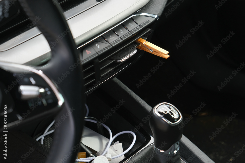 Installation of a clothespin on a car interior vent, impregnated with essential oil. To detoxify and remove unpleasant odours. Installation of a clothespin on a car interior vent, impregnated with essential oil. To detoxify and remove unpleasant odours.