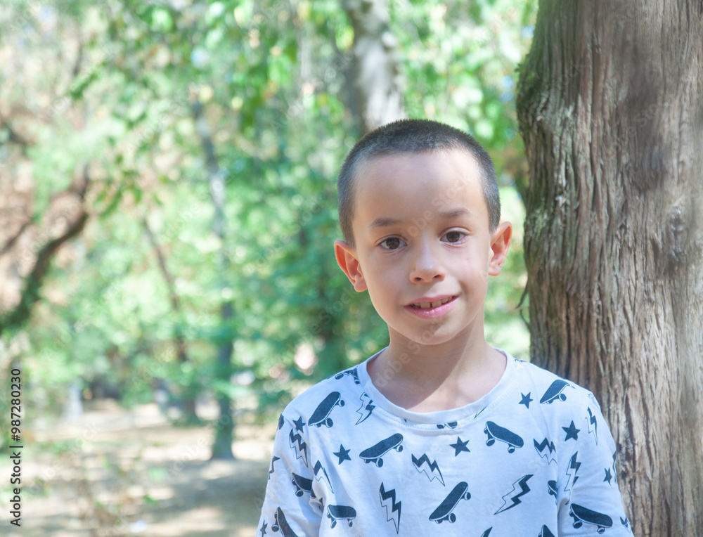 Portrait of little boy in the park. About 7 years. Portrait of little boy in the park. About 7 years.
