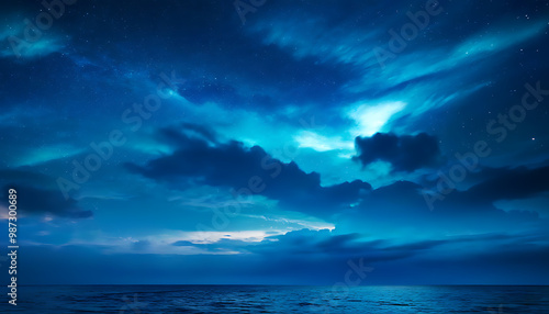 Nightly display of sea view with starlit sky and rolling clouds.