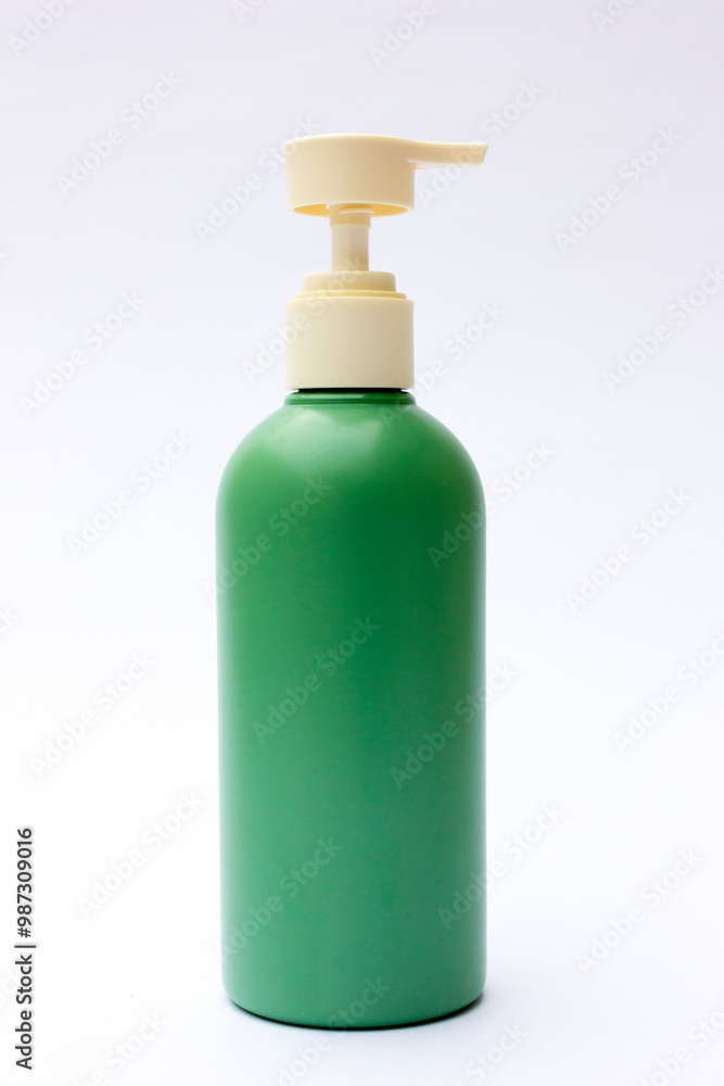 A green plastic bottle packaging. This bottle is a bottle design commonly used in soap, shampoo and beauty cream packaging such as body lotion etc. Use this image as your design mockup. A green plastic bottle packaging. This bottle is a bottle design commonly used in soap, shampoo and beauty cream packaging such as body lotion etc. Use this image as your design mockup.