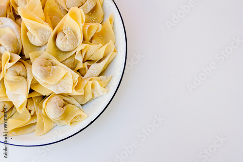 Raw wonton or dumpling dough is called pangsit in Indonesian. The term pangsit is used interchangeably with wonton or dumplings in Indonesian cuisine.  photo