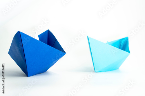 Paper colored boat isolated on white background. origami crafts. transport concept. origami.