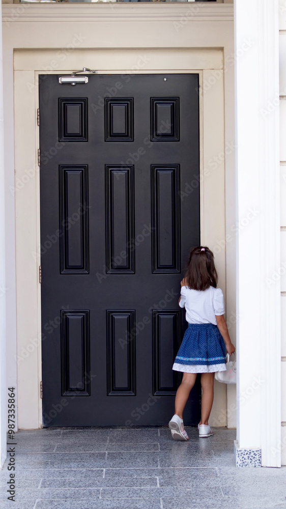 Girl standing in front of the door . High quality photo Girl standing in front of the door . High quality photo