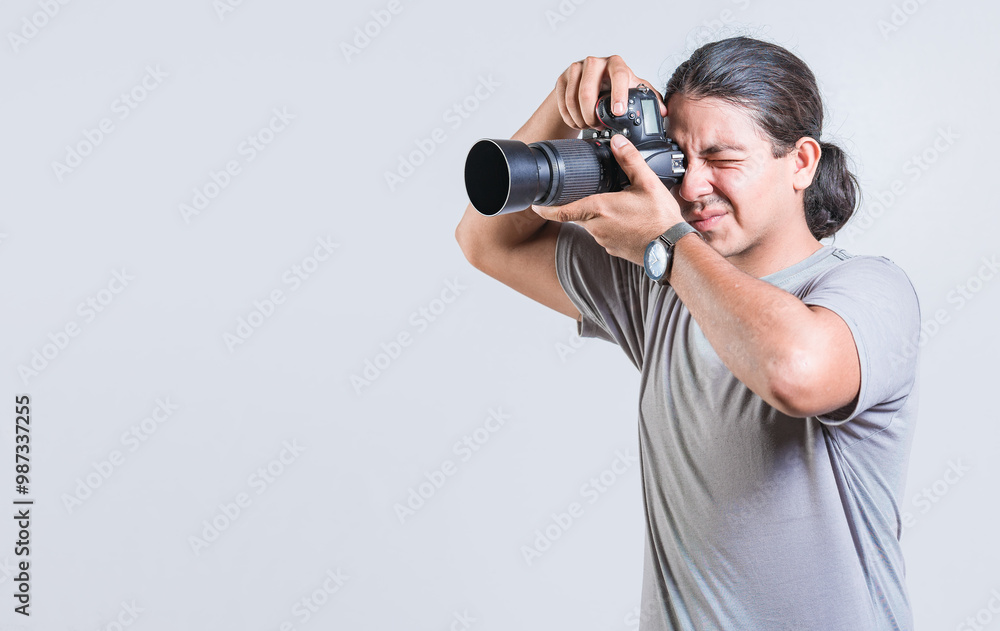 Male photographer taking photos isolated. Handsome photographer taking photos with dslr camera isolated Male photographer taking photos isolated. Handsome photographer taking photos with dslr camera isolated
