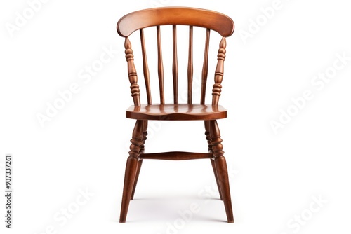 A classic wooden dining chair with a curved back and spindle legs