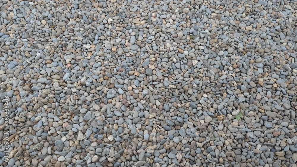 Video showcases a vibrant gravel texture. It is great for outdoor projects like pathways or gardens. The stones blend well with nature. Use it for landscaping inspiration Video showcases a vibrant gravel texture. It is great for outdoor projects like pathways or gardens. The stones blend well with nature. Use it for landscaping inspiration