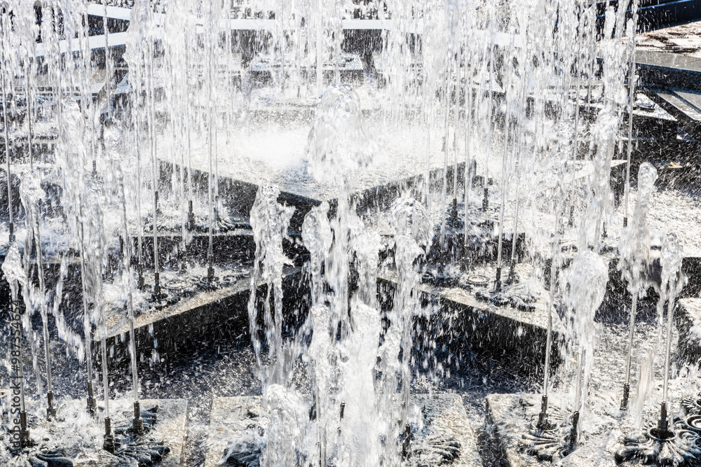 Fototapeta premium water jets of fountain closeup on sunny summer day