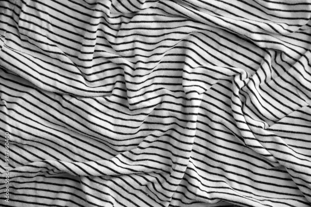 Processed collage of abstract black and white stripped cloth background with many folds Processed collage of abstract black and white stripped cloth background with many folds
