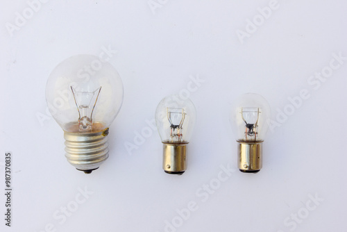 A light bulb, also known as an incandescent lamp or incandescent light globe, is an electric light that produces light by heating a filament until it glows. photo