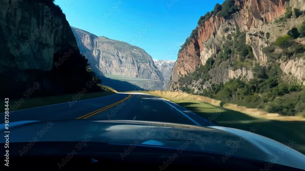 Scenic Drive Through a Majestic Mountain Canyon with Clear Blue Skies ...