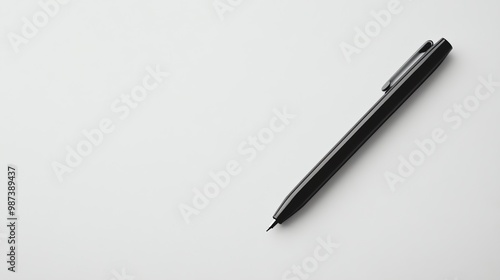 A black pen on a white surface.