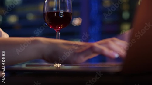 A woman works on her laptop in a cozy, serene atmosphere