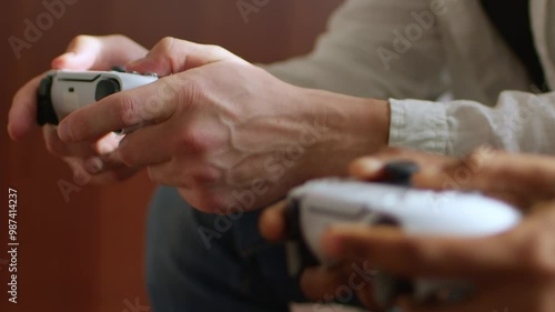 A man and woman enjoy a video game, sharing laughs and competition