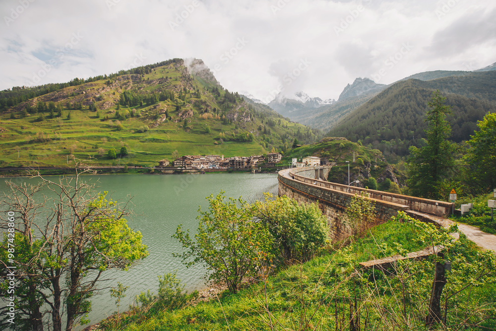Naklejka premium Dike at Pontechianale in Val Varaita, Italy, 2023. Wall of the dike at Pontechianale. 