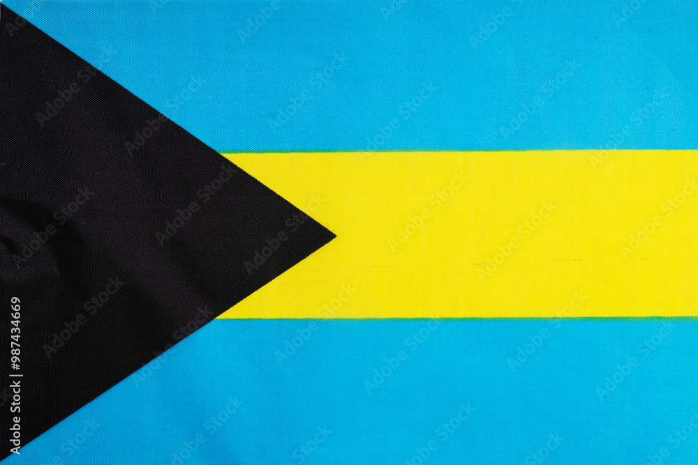 National flag of the state of the Bahamas close-up. State background. National flag of the state of the Bahamas close-up. State background.
