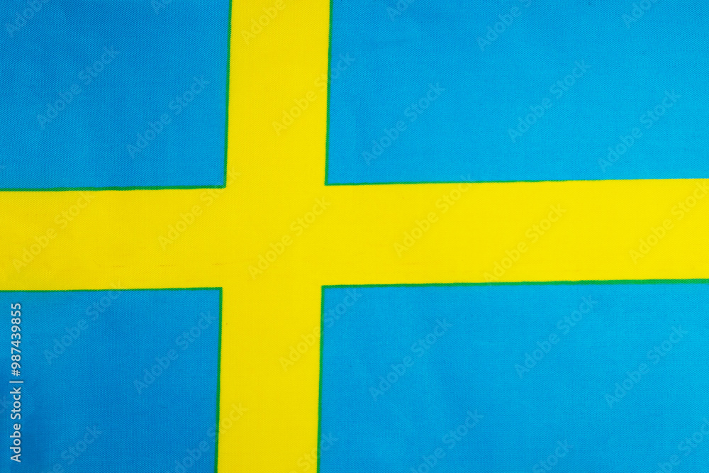 National flag of the state of Sweden close-up. State background. National flag of the state of Sweden close-up. State background.